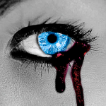woman's electric blue eye with tears of blood
