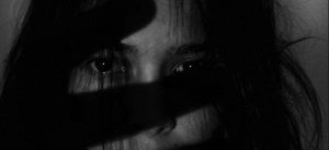 Photo by Joanne Adela Low from Pexels of young woman covering her face with her hands